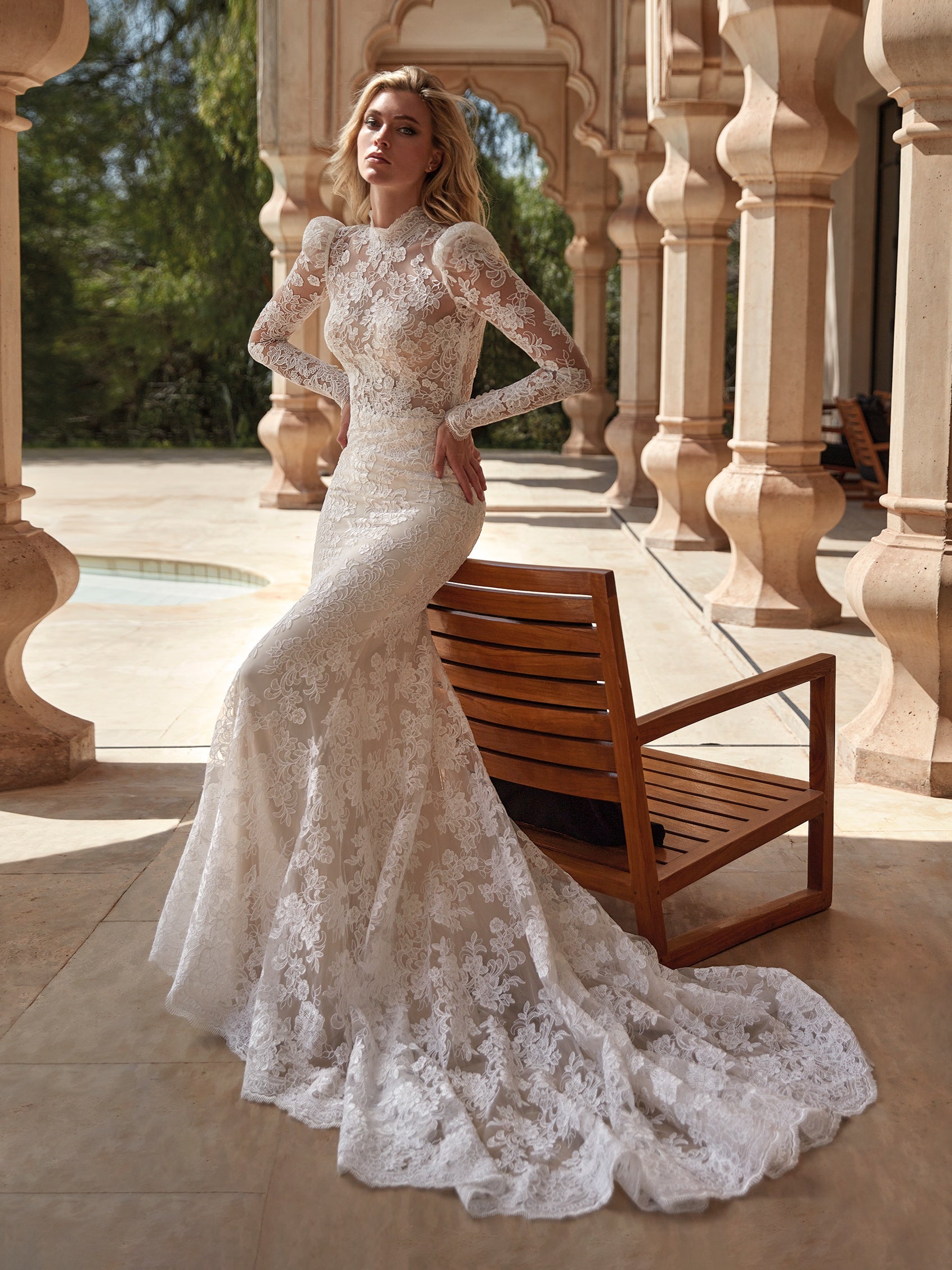 Photo of Bride wearing white wedding gown by the beachside