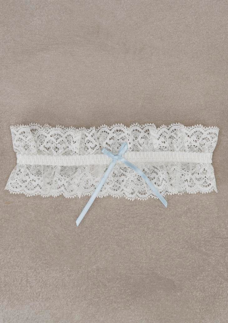 Lace-detailed bridal garter with a light blue ribbon