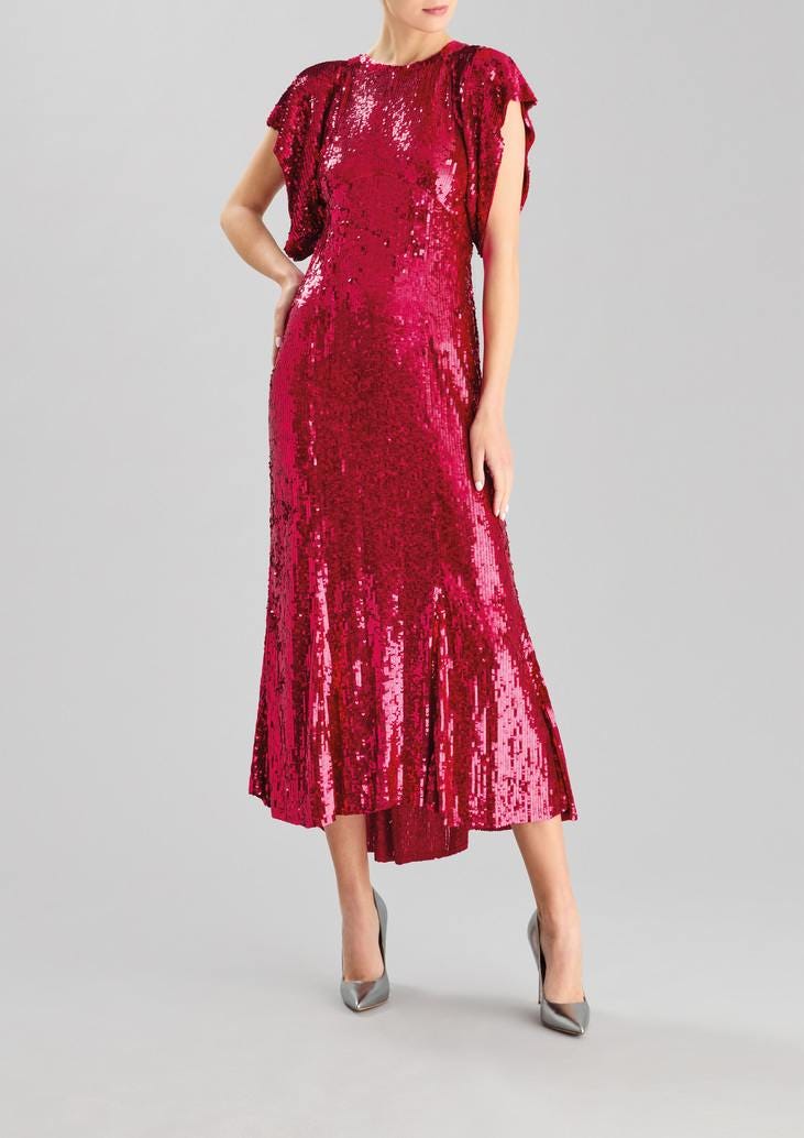 Woman wearing a pink fit and flare party dress in sequin with crew neckline and cap sleeves